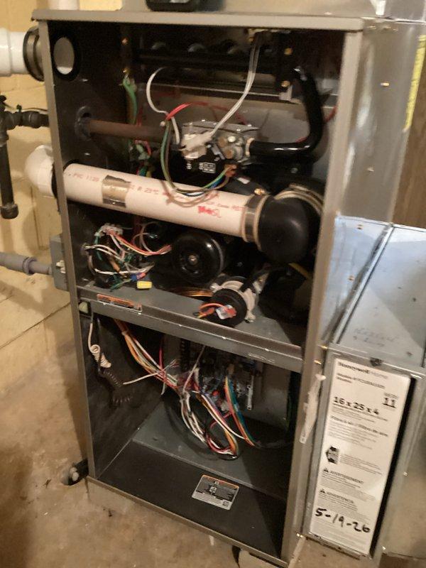 Completed comprehensive furnace tune-up and inspection. Accessed internal components, verified proper operation of blower motors across all zones, inspected electrical connections and wiring for secure termination, and confirmed PVC condensate drainage system is functioning correctly. All system components operating within normal parameters with no immediate concerns identified.