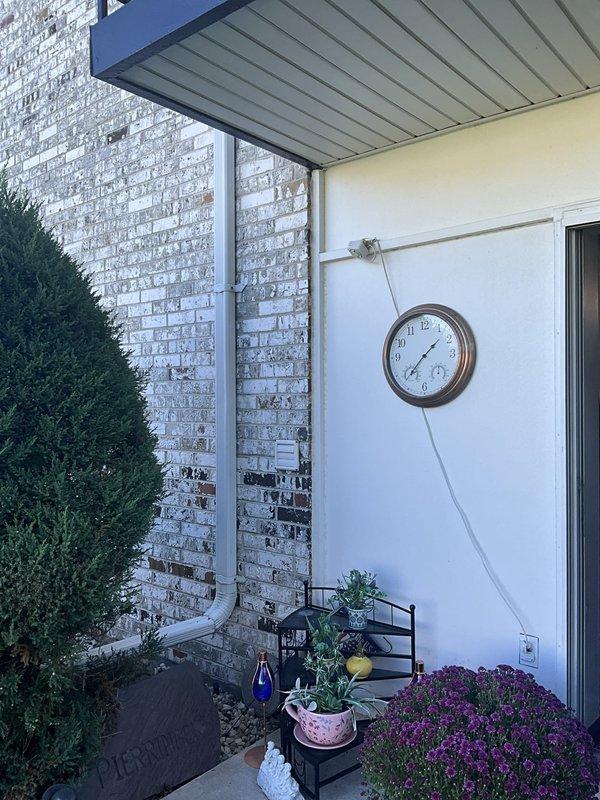 Conducted on-site evaluation for mini split system installation at residential property. Assessed outdoor patio area with covered entryway for optimal placement of condenser unit and indoor air handler, documenting existing electrical conduit routing and structural considerations for future equipment mounting and refrigerant line installation.