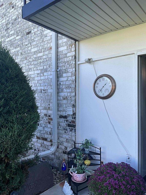 Conducted on-site evaluation for mini split system installation at residential property. Assessed outdoor patio area with covered entryway for optimal placement of condenser unit and indoor air handler, documenting existing electrical conduit routing and structural considerations for future equipment mounting and refrigerant line installation.