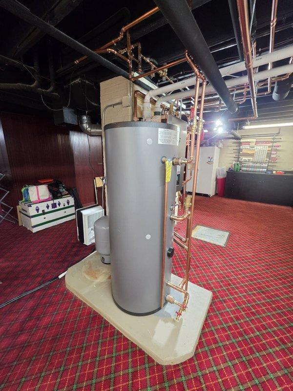 Completed installation of high-efficiency NTI boiler system with indirect-fired water heater in basement mechanical room. All copper piping, valves, and fittings installed per manufacturer specifications with proper venting and circulator pump integration. Installation performed under permit with electrical work coordinated through licensed electrician, ensuring full code compliance and system commissioning.