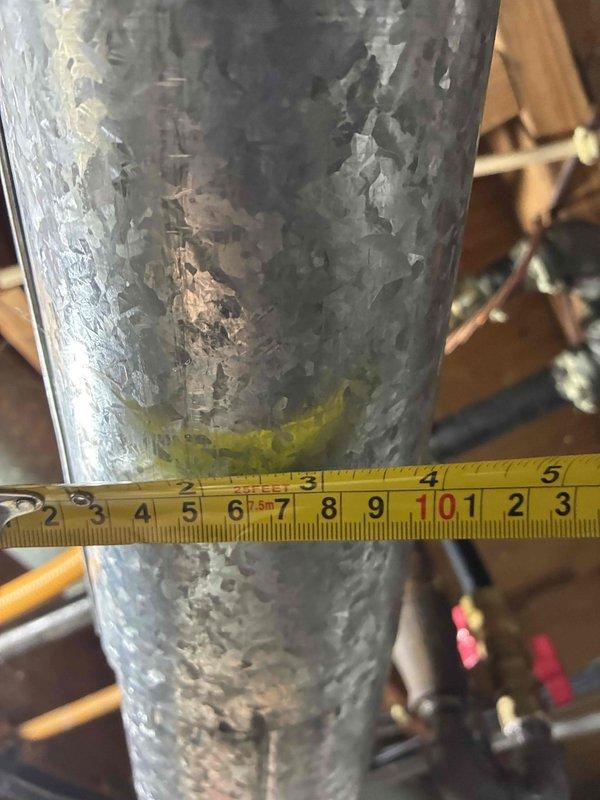 Responded to no hot water condition and performed on-site assessment of existing water heater system. Documented measurements and current equipment specifications, including tank dimensions and venting configuration. Evaluated deteriorated vent pipe showing significant galvanized coating failure and corrosion. Captured photographic documentation of existing water heater unit and compromised venting components for estimate preparation. Prepared comprehensive replacement estimate and coordinated follow-up communication to review proposed scope of work for water heater and venting system replacement.