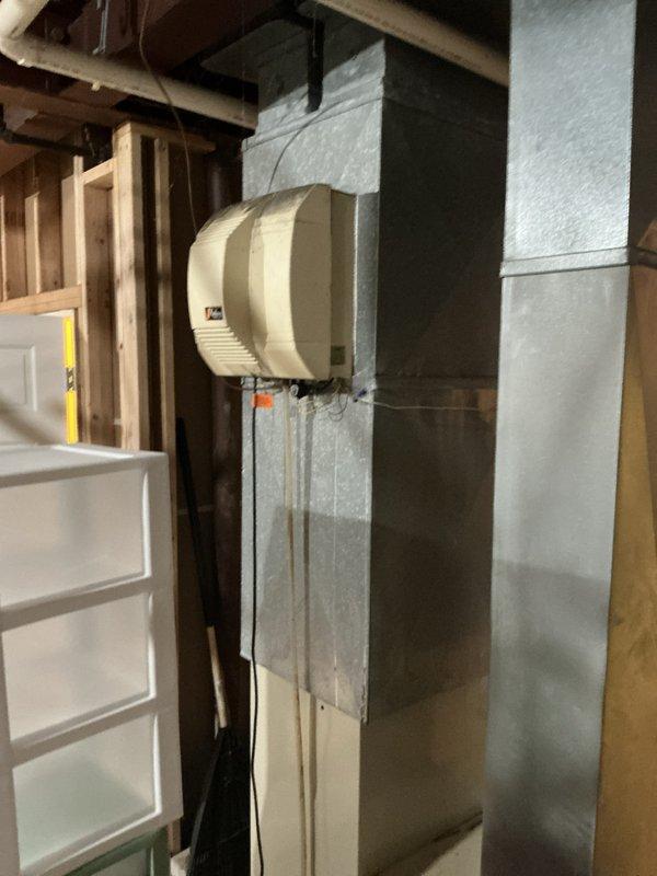 Completed on-site estimate for natural gas furnace replacement and combination furnace/AC system replacement in basement location. Assessed existing HVAC equipment, ductwork configuration with mounted humidifier unit, and electrical service panel capacity to determine appropriate replacement options and installation requirements.