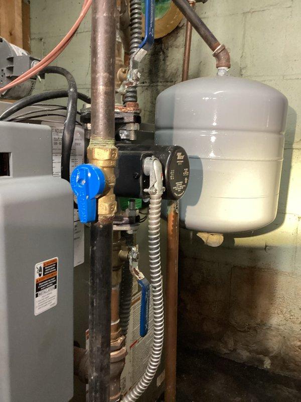 Completed HVAC tune-up service on residential heating system. Performed standard maintenance inspection of boiler equipment, expansion tank, circulator pump, and associated plumbing components including copper supply lines, ball valves, and pressure relief systems. All mechanical components photographed and verified operational, with system confirmed functioning within normal parameters.