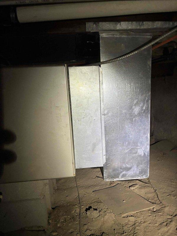 Completed estimate for furnace replacement in crawlspace accessible via cellar door on west side of home. Inspected 15-year-old Carrier unit with two failed heat exchangers, one previously replaced. Documented existing HVAC system including metal ductwork, support structures, and equipment layout through photos. Coordinated arrival via phone communication and assessed replacement options for non-operational furnace system.