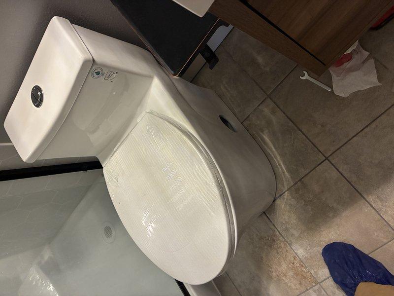 Completed toilet flange replacement at residential bathroom. Removed deteriorated flange showing significant rust staining and corrosion around mounting bolt holes. Installed new flange, ensuring proper seal and secure mounting to existing tile floor. Toilet reinstalled and tested for proper operation and leak-free performance.