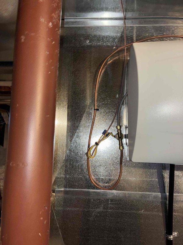 Performed routine heating maintenance visit as part of family membership agreement. Upon arrival, discovered split Aprilaire humidifier tubing requiring immediate attention. Shut off water supply to the humidifier system to prevent water damage and replaced the damaged tubing with new Aprilaire tubing. Inspected HVAC system components including ductwork, copper refrigerant lines, and electrical connections in the attic space. All connections secured and system restored to proper operation.