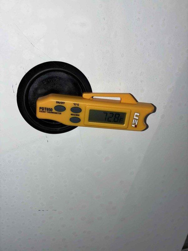 Responded to no heat call with reported odor and non-functioning air conditioning system. Upon arrival, inspected residential furnace unit in utility closet and found system operational with ambient temperature reading of 72.9°F. Performed visual inspection of furnace cabinet, refrigerant lines, condensate drain, and ductwork connections. No active fault conditions detected at time of service call. Unit appeared to have accumulated normal dust and debris on exterior surfaces. All visible components including copper refrigerant lines with insulation, PVC condensate piping, and electrical connections showed no signs of immediate failure or safety concerns.