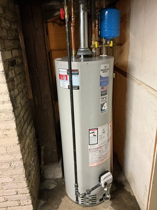 Completed full HVAC system replacement including installation of new furnace, air conditioning unit, and thermostat in basement utility area. Adapted system to existing 2" PVC venting infrastructure and reused existing filter cabinet to maintain cost efficiency. Installed new 25-foot refrigerant line set with proper insulation, connecting outdoor condensing unit to indoor air handler. Configured air handler with condensate pump and drainage lines for proper moisture removal. Additionally installed new residential water heater with complete gas connections, pressure relief valve, supply and return piping with brass fittings, and expansion tank mounted above unit. All installations performed to manufacturer specifications and local code requirements, with systems tested and operational upon completion.