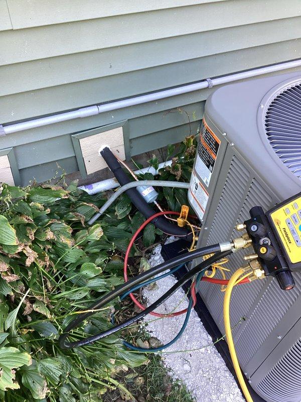 Completed full HVAC system installation including new furnace and air conditioning condenser unit. Installed outdoor AC condenser on concrete pad with proper refrigerant line connections and performed system charging and pressure testing using manifold gauges. Installed indoor furnace unit in basement utility area with appropriate venting and electrical connections. All equipment properly mounted, leveled, and secured per manufacturer specifications. System tested and verified operational with correct refrigerant pressures and airflow.