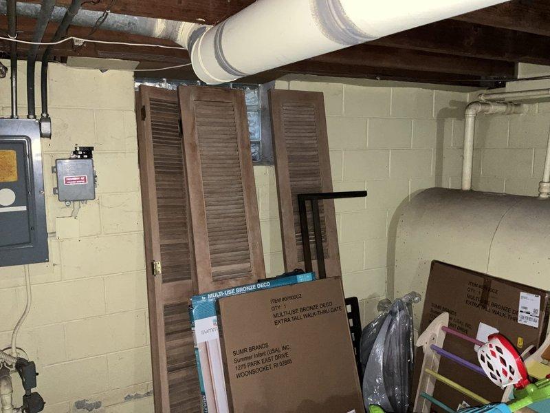 Completed furnace replacement estimate for 25-year-old oil furnace conversion to natural gas heating system. Assessed existing oil furnace unit, evaluated basement mechanical room layout, ductwork configuration, and electrical panel capacity. Documented requirement for natural gas line installation from street to residence as no existing gas service is currently available at the property.