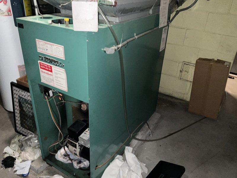 Completed furnace replacement estimate for 25-year-old oil furnace conversion to natural gas heating system. Assessed existing oil furnace unit, evaluated basement mechanical room layout, ductwork configuration, and electrical panel capacity. Documented requirement for natural gas line installation from street to residence as no existing gas service is currently available at the property.