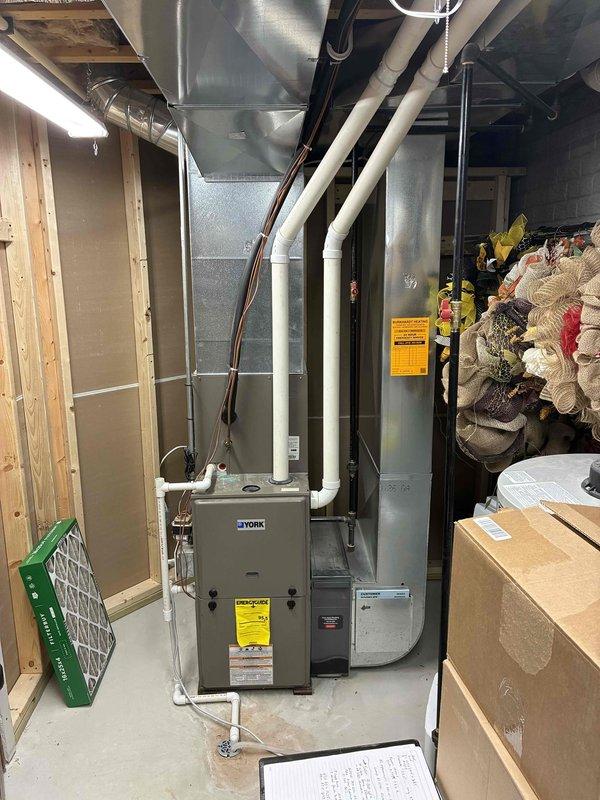 Completed estimate for replacement of existing York natural gas furnace and air conditioning system located in basement mechanical room. Both units currently operational but aging, with customer seeking proactive replacement to avoid emergency failure situation. Assessed existing equipment configuration, ductwork connections, electrical wiring at thermostat, condensate drainage, and refrigerant line routing to provide comprehensive replacement proposal.
