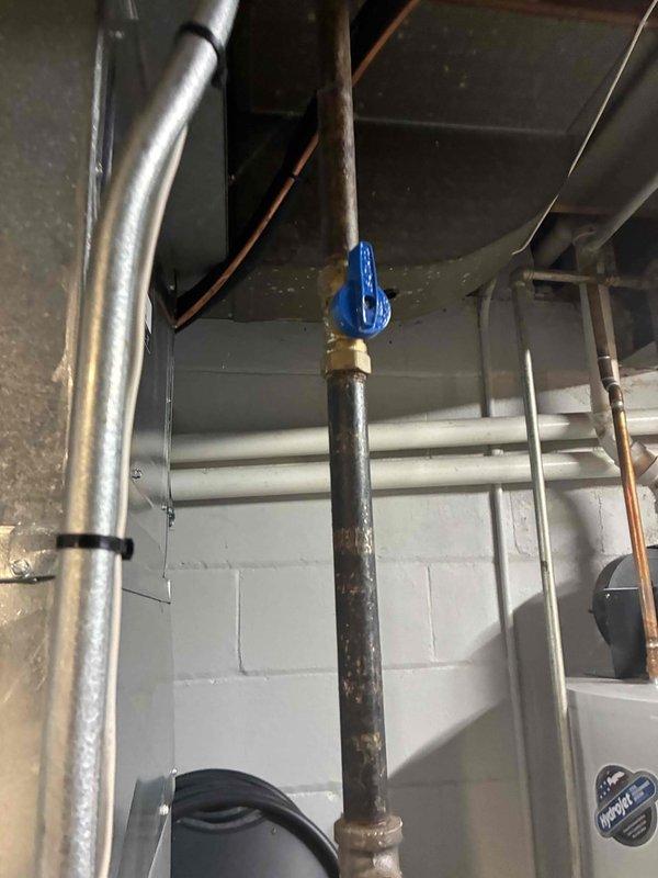 Responded to service call for non-functioning thermostat. Upon arrival, conducted diagnostic inspection of HVAC system and associated components in basement utility area. Inspected internal system components including motor assembly, wiring connections, and condensate drainage system. Verified proper operation of all mechanical components and electrical connections within the unit. System restored to normal operation with thermostat functioning properly.