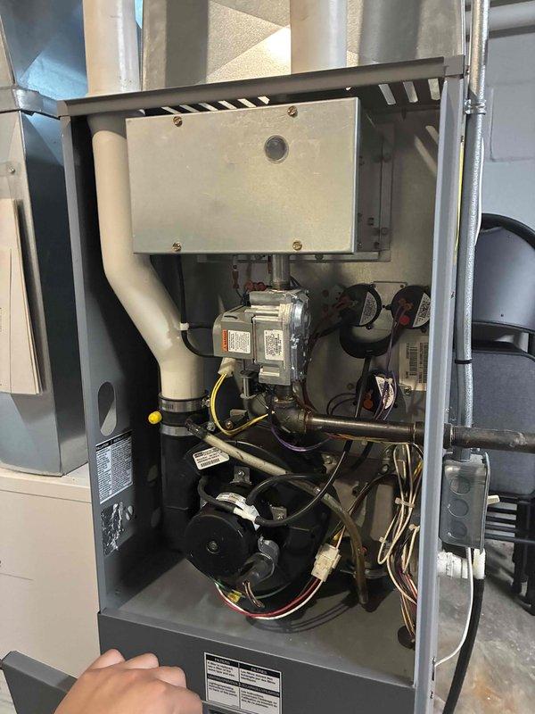 Responded to service call for non-functioning thermostat. Upon arrival, conducted diagnostic inspection of HVAC system and associated components in basement utility area. Inspected internal system components including motor assembly, wiring connections, and condensate drainage system. Verified proper operation of all mechanical components and electrical connections within the unit. System restored to normal operation with thermostat functioning properly.