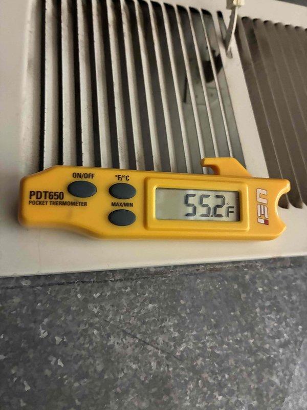 Completed comprehensive furnace and air conditioning tune-up service. Verified system operation with supply air temperature reading of 55.2°F at the register, confirming adequate cooling performance. Inspected and tested the dual-run capacitor, which showed signs of age and surface corrosion but remained within operational parameters.