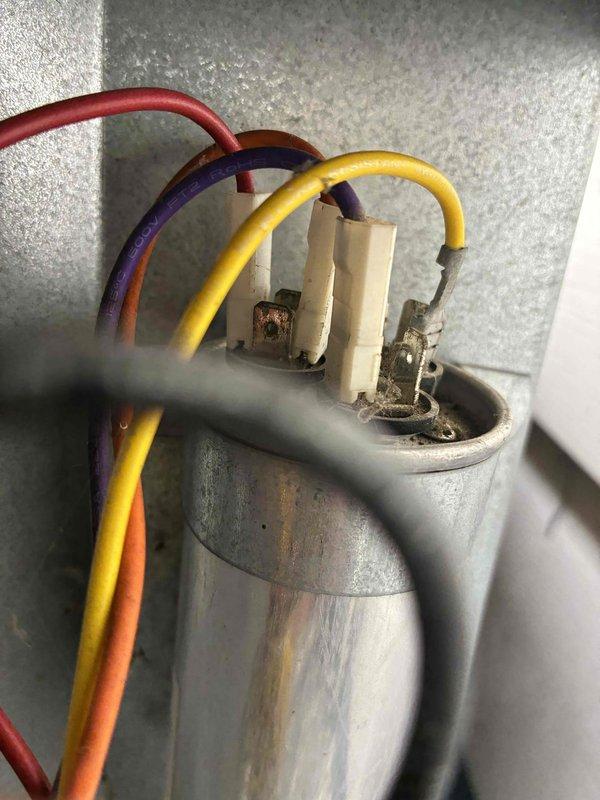Completed comprehensive furnace and air conditioning tune-up service. Verified system operation with supply air temperature reading of 55.2°F at the register, confirming adequate cooling performance. Inspected and tested the dual-run capacitor, which showed signs of age and surface corrosion but remained within operational parameters.