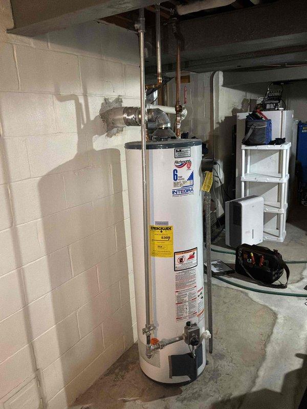 Completed on-site evaluation of existing natural gas furnace and air conditioning system located in basement. Both units are operational but aging and nearing end of serviceable life. Documented current equipment configuration including outdoor condensing unit on concrete pad with proper electrical disconnect, and basement-mounted furnace with existing ductwork infrastructure. Provided comprehensive replacement estimate for new high-efficiency furnace and AC system to homeowner.