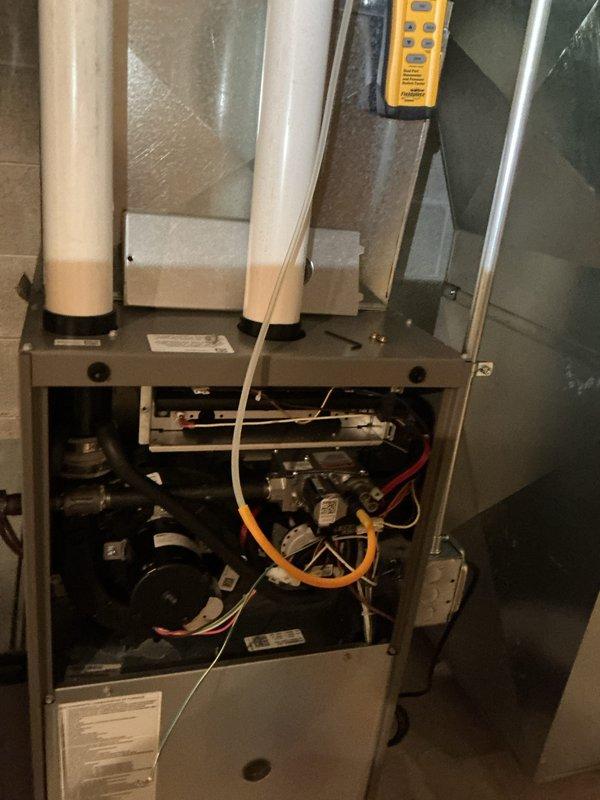 Completed comprehensive furnace tune-up on residential gas heating system following recent installation. Performed full system inspection including visual examination of all internal components, gas valve assembly, blower motor, electrical connections, and PVC venting system. Verified proper operation of all safety controls, confirmed secure wiring connections throughout unit, and ensured combustion air intake and exhaust venting were properly installed and sealed. All components found to be functioning within manufacturer specifications with no adjustments required.