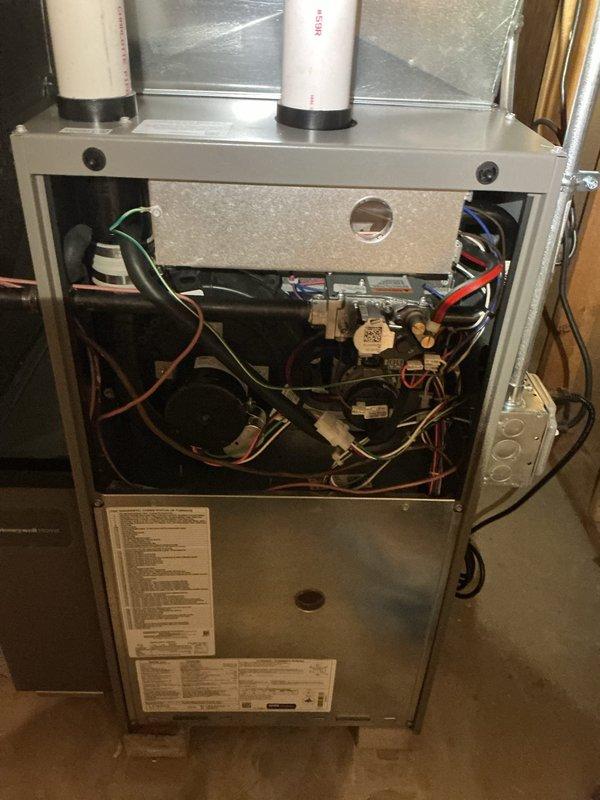 Completed comprehensive furnace tune-up on residential gas heating system following recent installation. Performed full system inspection including visual examination of all internal components, gas valve assembly, blower motor, electrical connections, and PVC venting system. Verified proper operation of all safety controls, confirmed secure wiring connections throughout unit, and ensured combustion air intake and exhaust venting were properly installed and sealed. All components found to be functioning within manufacturer specifications with no adjustments required.