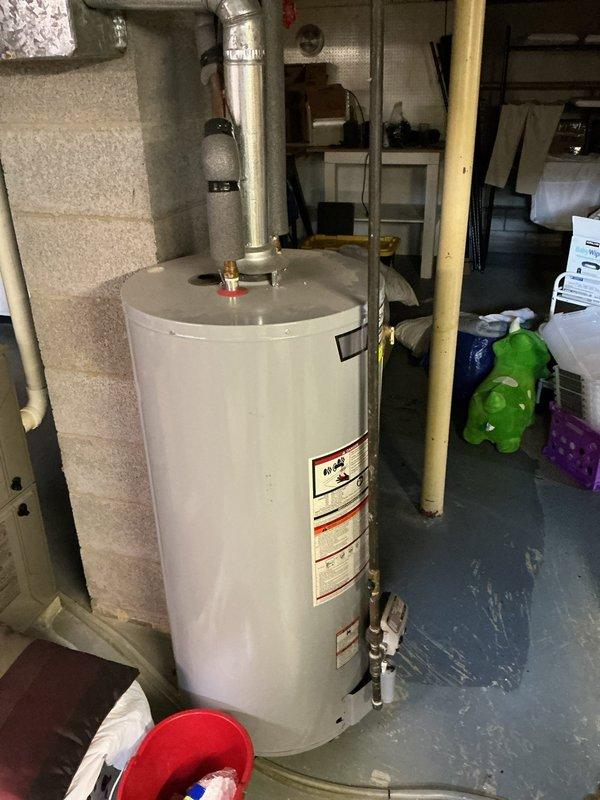 Provided estimate for rerouting water heater venting system from existing chimney configuration to exterior wall termination. Assessed current AO Smith water heater installation and evaluated venting requirements for compliance with manufacturer specifications and local codes. Recommended exterior wall venting solution to improve draft efficiency and eliminate chimney dependency.