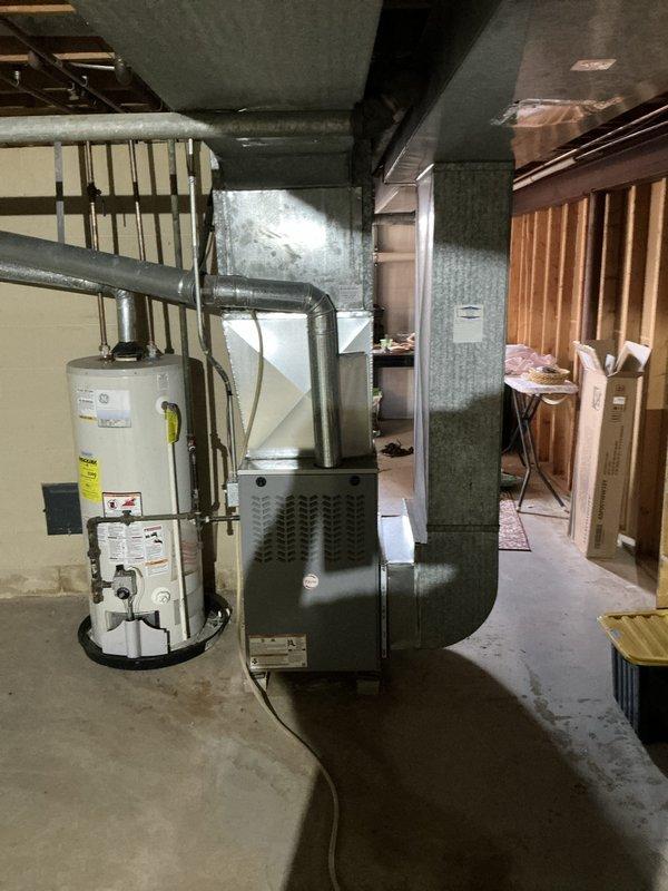 Completed estimate for replacement of existing gas furnace located in basement mechanical room. Assessed current HVAC system including gray metal furnace unit with return air grille and associated ductwork, as well as existing Honeywell digital thermostat. Provided replacement options and recommendations for new equipment installation.