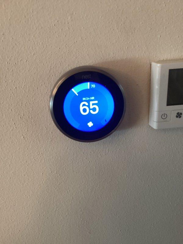 Responded to customer complaint of delayed start on air conditioning unit occurring over several nights. Performed diagnostic evaluation using digital manifold gauges to assess system pressures and temperatures on Lennox Elite unit. Verified thermostat operation and settings, confirming unit communication and proper display function at 65°F current temperature with 70°F setpoint.