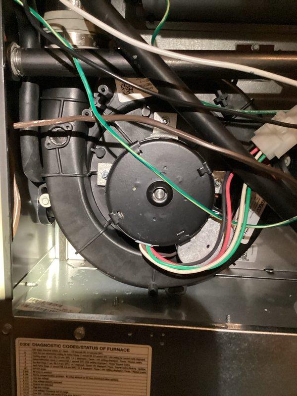 Completed warranty replacement of failed inducer motor assembly on residential furnace system. Removed defective motor, installed new OEM replacement unit, verified proper electrical connections and secure mounting, and confirmed system operation with successful startup and diagnostic check.