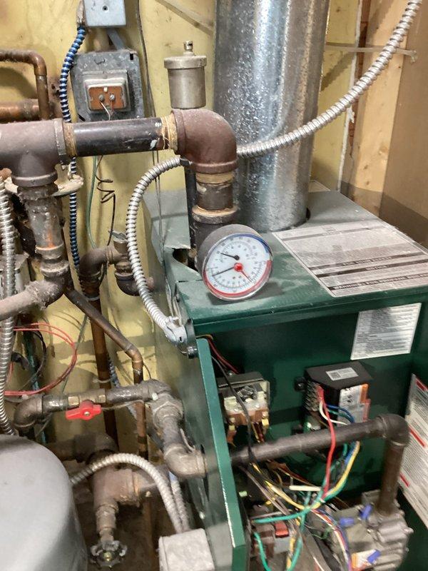 Completed comprehensive tune-up on mid-efficiency gas boiler for homeowner new to the property. Performed standard maintenance procedures including inspection of all mechanical components, pressure gauge verification, electrical connections, piping systems, and expansion tank. Provided detailed orientation on thermostat operations and explained heating system controls to familiarize homeowner with equipment functionality.