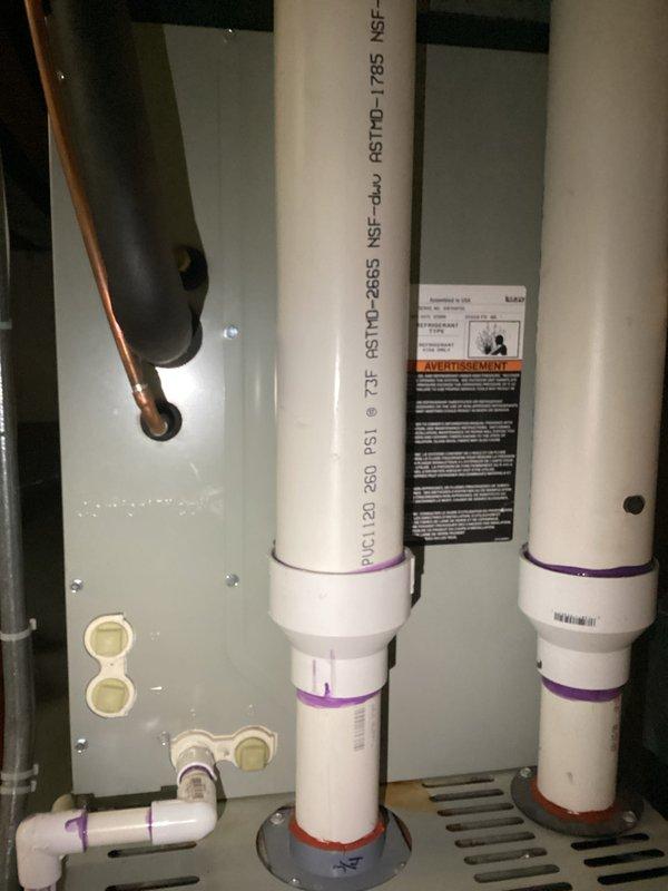 Completed comprehensive furnace and air conditioning tune-up service including inspection of outdoor condensing unit and associated plumbing components. Unit exterior showed normal seasonal debris accumulation; all mechanical systems inspected and verified operational, with water heater ventilation and PVC drainage systems confirmed properly installed per manufacturer specifications.