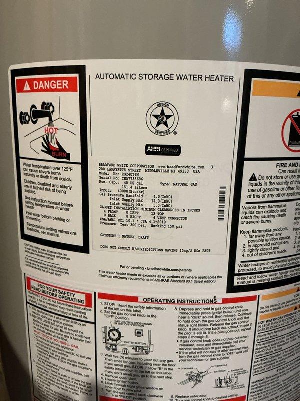 Responded to service call for leaking 40-gallon natural gas Bradford White water heater. Upon arrival, confirmed severe tank leak requiring full unit replacement. Removed existing failed water heater and installed new 40-gallon natural gas tall model with proper venting, gas line connections, and plumbing tie-ins. Connected copper supply lines, installed safety relief valve, and mounted expansion tank. Verified all connections for proper operation and tested unit for leaks before restoring service.