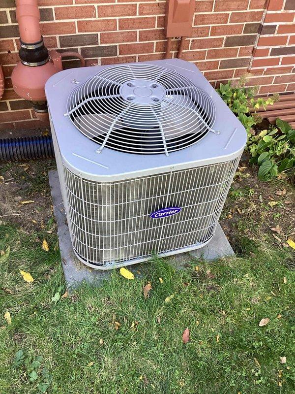 Performed diagnostic on a Carrier split-system air conditioner reporting fan operation without cooling. Inspected the outdoor condenser unit, finding it intact with no visible frost, rust, or physical damage, and checked the indoor air handler, ductwork, and electrical connections. Evaluated system operation to identify the cause of the loss of cooling.