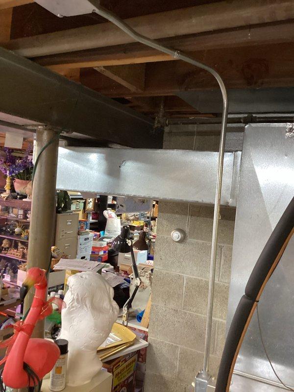 Performed diagnostic on a Carrier split-system air conditioner reporting fan operation without cooling. Inspected the outdoor condenser unit, finding it intact with no visible frost, rust, or physical damage, and checked the indoor air handler, ductwork, and electrical connections. Evaluated system operation to identify the cause of the loss of cooling.