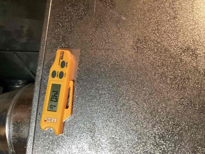 Performed a seasonal tune-up and safety inspection on a Bryant gas furnace, including visual inspection of the cabinet, condensate/PVC venting, and connections, with no signs of rust, frost, or damage. Verified heating operation by measuring supply duct surface temperature at 140.1°F with a digital pocket thermometer, confirming proper heat output. Unit left in good working order with service sticker applied.
