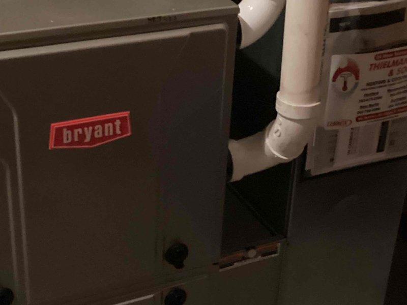 Performed a seasonal tune-up and safety inspection on a Bryant gas furnace, including visual inspection of the cabinet, condensate/PVC venting, and connections, with no signs of rust, frost, or damage. Verified heating operation by measuring supply duct surface temperature at 140.1°F with a digital pocket thermometer, confirming proper heat output. Unit left in good working order with service sticker applied.