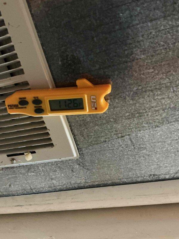 Performed a full HVAC tune-up, measuring supply air temperature at the register (112.6°F) to verify heating output and noting dirt and debris buildup on the register slats. Used a borescope to inspect the heat exchanger and found corrosion and rust patches along an internal seam, which should be monitored and evaluated for further repair or replacement.