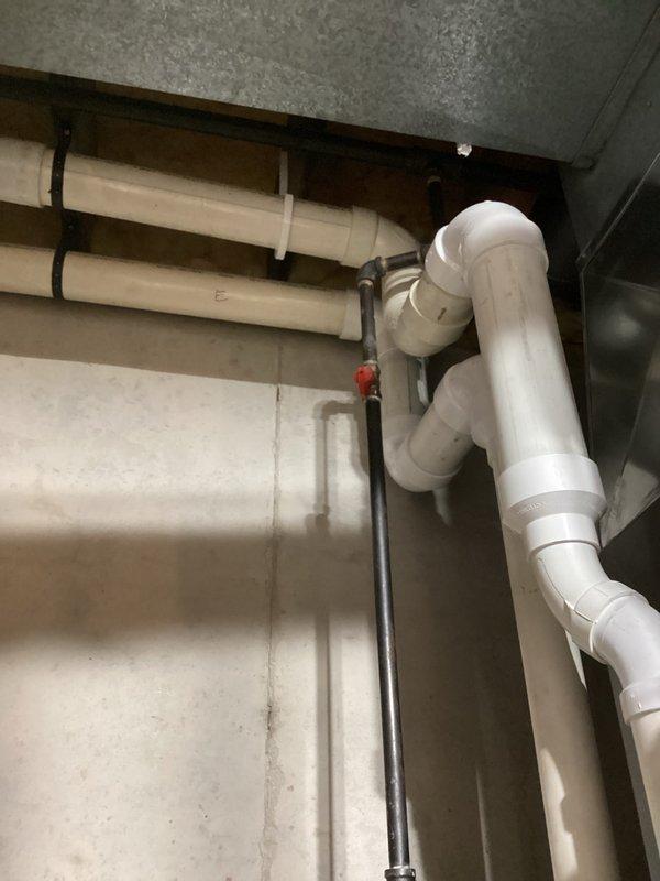 Performed a seasonal heating system tune-up, including inspection of the furnace casing, ductwork connections, and secured electrical conduit in the mechanical space. Verified the condensate drain assembly and PVC piping were properly supported and free of leaks, and confirmed the gas supply line and shutoff valve were in good condition with no signs of rust, frost, or moisture damage. System operation was checked and left functioning properly.