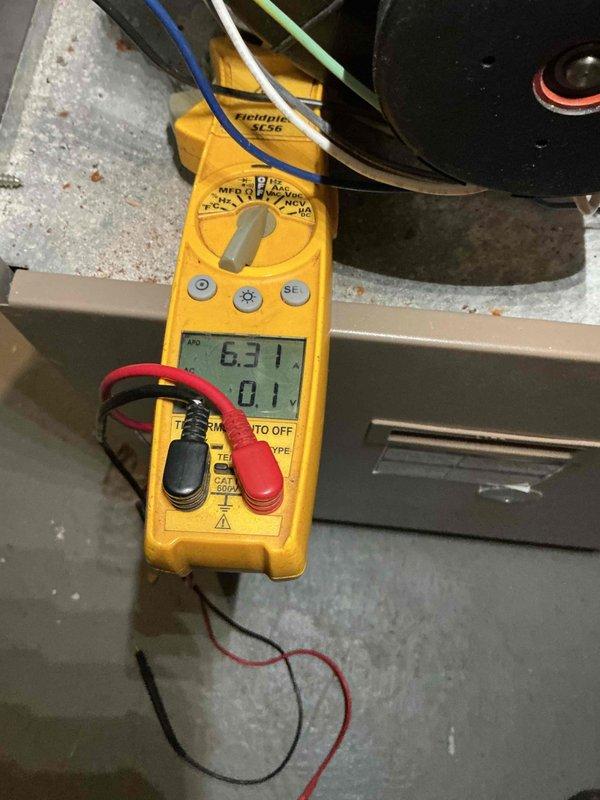Performed tune-ups on two basement gas furnaces, including inspection of burner assemblies and electrical measurements with a clamp meter on the blower motor circuit. Significant corrosion was found at the heat exchanger inlet openings on one unit, along with oxidation on the burner tubes, and further evaluation of the heat exchanger's condition is recommended.