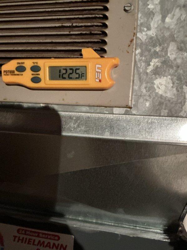 Performed a furnace tune-up, inspecting the gas valve assembly, flame sensor/igniter, wiring connections, and inducer motor housing, all of which showed light dust and normal wear with no signs of rust, frost, or breakage. Verified system operation and measured a supply air temperature of 122.5°F at the register, confirming the unit is heating normally.
