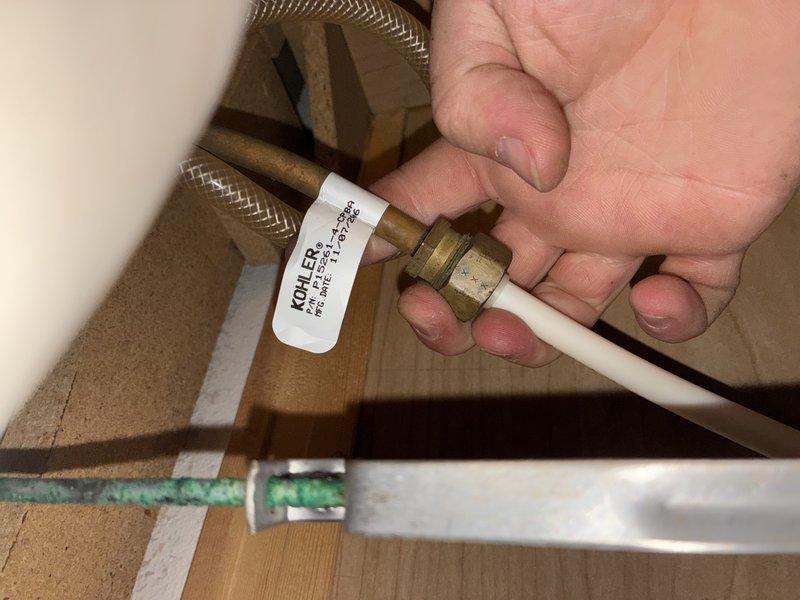 Re-caulked the kitchen sink perimeter to restore a watertight seal. Diagnosed dripping faucets at the master bathroom deck-mounted tub fixture and the guest bathroom fixture, inspecting the under-fixture brass compression supply connections and flexible supply lines for leaks and wear. The inspection also found corrosion on nearby hardware beneath the fixture.