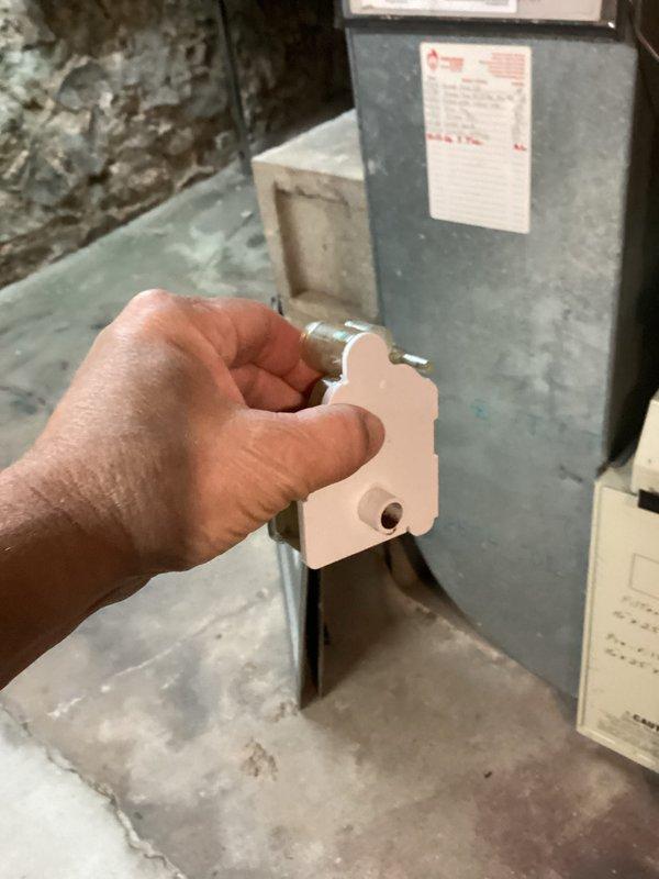 Performed tune-ups on two gas furnaces, one in the residence and one in the garage, including removal of access panels to inspect the gas valve assembly, inducer motor, blower components, control board, and wiring harness. Verified equipment data plates and recorded model and serial information for service records. No frost, rust, or component breakage was observed, and both units were reassembled and returned to service.