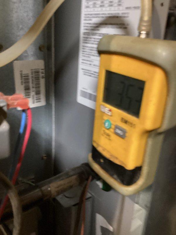 Performed a furnace tune-up, inspecting the blower assembly, flame sensor, and control wiring within the cabinet and checking system operation with a digital multimeter. Cleaned accumulated dust and debris from the cabinet interior and verified connections and components were in proper working condition.