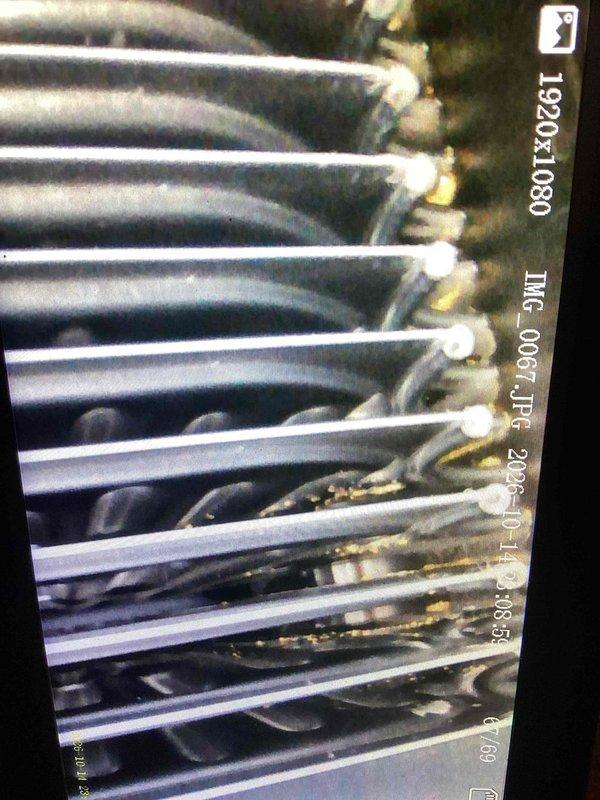 Performed tune-ups on two furnaces, including inspection of the heat exchanger and blower assembly with a borescope camera, which revealed light debris and residue buildup on the blower wheel and heat exchanger surfaces. Cleaned and tested both units for proper operation, and installed a new thermostat.