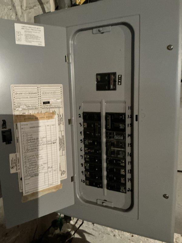 Performed an on-site evaluation for replacement of the basement furnace, which had been shut down due to a failed heat exchanger. Inspected the installation area, including the nearby floor drain and the electrical service panel, to verify clearances and confirm available circuits for the new equipment. Confirmed the attic furnace (2017) is operating without issues and does not require replacement, and documented findings to support the replacement estimate for the basement unit.