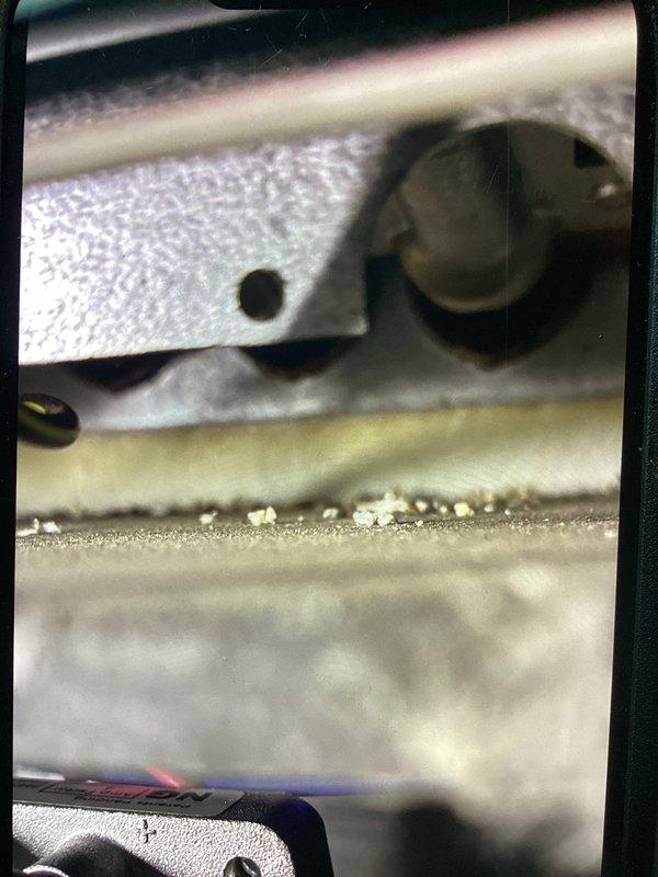 Performed a no-charge second-opinion evaluation of the air conditioning system, previously reported by another contractor as improperly installed, inspecting the Lennox gas furnace with the access panel removed to review the burner compartment, blower assembly, wiring, gas line and shutoff, and PVC venting. Observed light granular debris on the burner area surface but found no frost, rust, or visible damage, and the furnace was documented with photos for the customer's records.