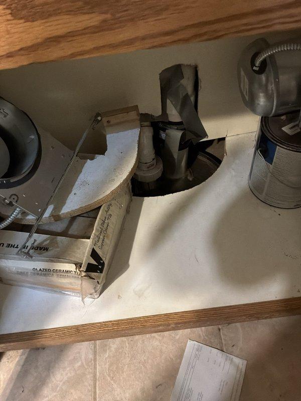 Performed an on-site estimate for replacement of a gas power-vent water heater, assessing the existing tank, PVC exhaust venting, gas supply piping, and surrounding supply plumbing for code-compliant removal and installation. Also evaluated the sump pump system for replacement with a battery backup unit, documenting existing conditions and noting that clutter and stored materials in the work areas will need to be cleared for safe access.