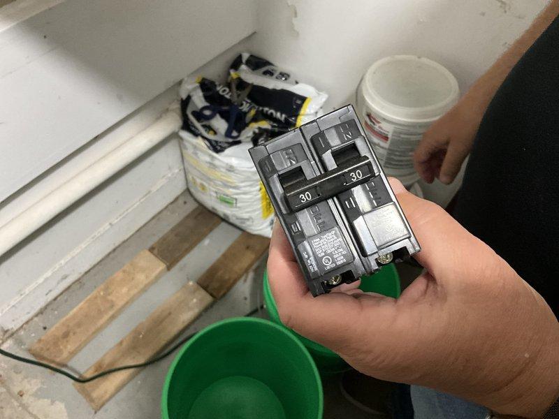 Performed an on-site evaluation for replacement of the original 1987 heating system, with the homeowner interested in upgrading to a heat pump or the best-suited option for the home. Inspected the existing flex duct and galvanized plenum connections, noting worn, foil-taped ductwork and a cut ceiling access opening, and verified the existing 30-amp double-pole breaker serving the equipment to assess electrical capacity for the new system. Findings will be used to recommend an appropriately sized, energy-efficient heat pump replacement and any necessary duct and electrical modifications.