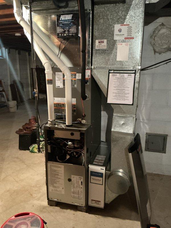 Performed a complete tune-up on the gas furnace, including inspection of the burners, wiring, and internal components with the lower access panel removed, and verified proper operation of the heating cycle. Reprogrammed the Lennox thermostat schedule to raise heating setpoints during daytime hours and lower them overnight. Installed a new 16x25 media air filter in the filter cabinet to ensure adequate airflow and filtration.