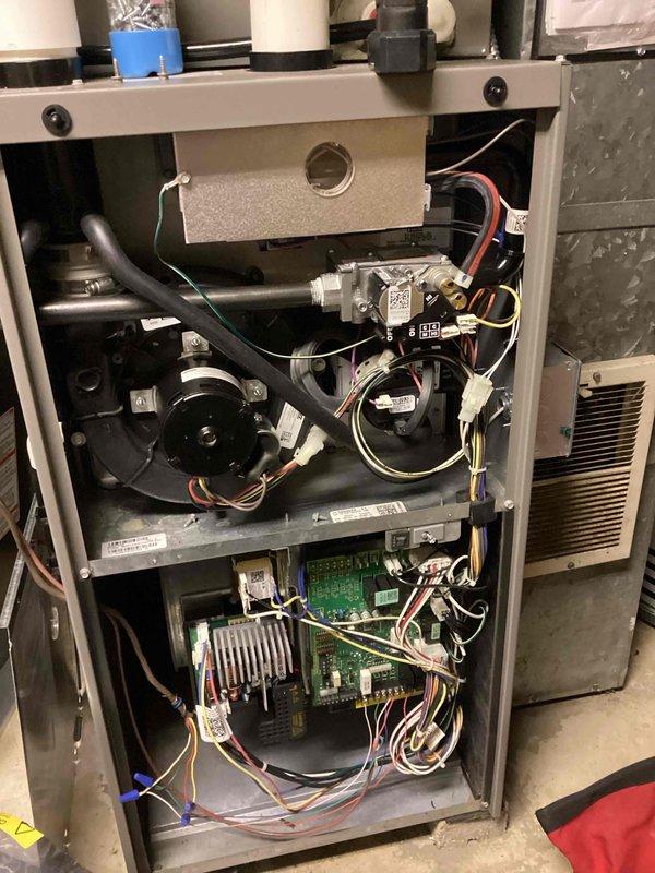 Responded to a no-heat call on a gas furnace under 10 years old and inspected the unit, finding the integrated furnace control board and its wiring harness connections to be the likely cause of the failure. The control module was removed for evaluation and diagnostics, with no frost, rust, or physical damage observed on the inducer, gas valve, or blower components. Recommended control board replacement to restore ignition sequence and heating operation.