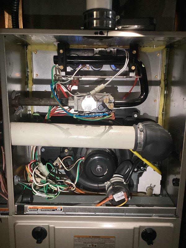 Performed a furnace tune-up, inspecting the burner assembly, gas valve, inducer motor, blower housing, pressure switch, and wiring connections, and verifying that the PVC venting and gas piping were secure and free of leaks, corrosion, or damage. The system was found in good operating condition with no deficiencies noted.