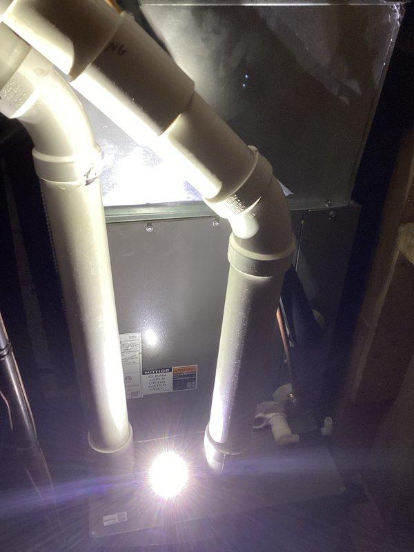Replaced the failed evaporator coil under manufacturer parts warranty, including removal of the defective coil, installation of the new coil, and reconnection of the condensate drain and refrigerant lines. Connected manifold gauges to the Lennox condensing unit to evacuate, recharge, and verify proper refrigerant charge and system operation after the repair.